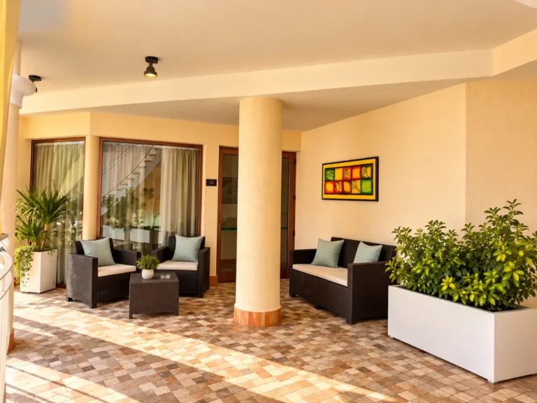 Salottino in rattan nella loggia coperta, Bellavista Rooms Villasimius